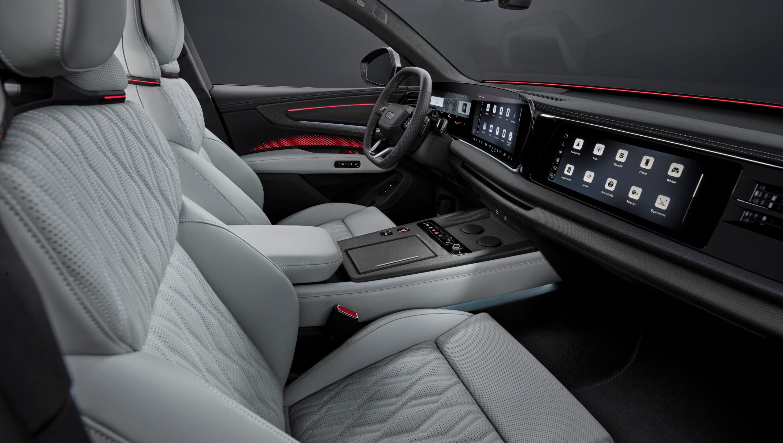 Vista completa de la zona delantera del Audi Q9 2026 con pantalla MMI y consola